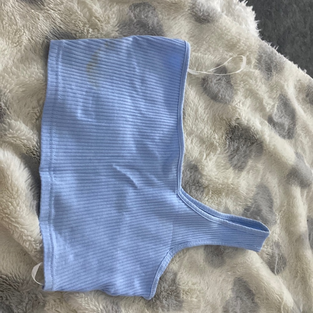 Used blue crop top with a stain, good material , extra small